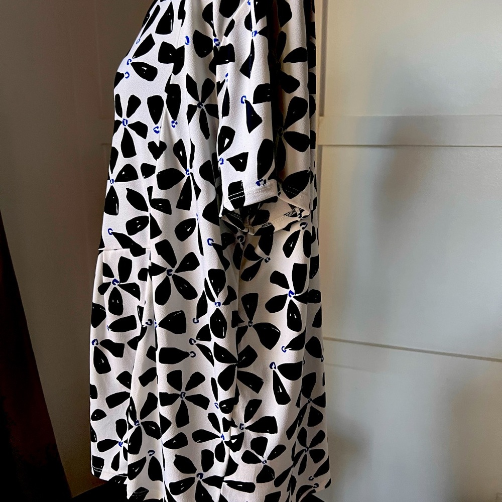 Floral patterned black and white blouse.